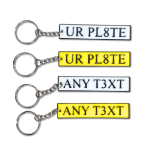 Custom number plate keyring bulk orders UK with personalised white and yellow number plate keychains